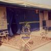 Vertical logo banner, custom stripe stall drapes, and striped valances