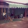 Striped canopy, logo banner, and stall drapes