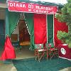 Horizontal stripe panel, zipper door, banner, custom chairs, logo table cover, and drape cover