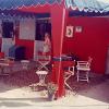 Scalloped canopy cover with pole drapes, stall door panels, custom chair seats, and drape panels